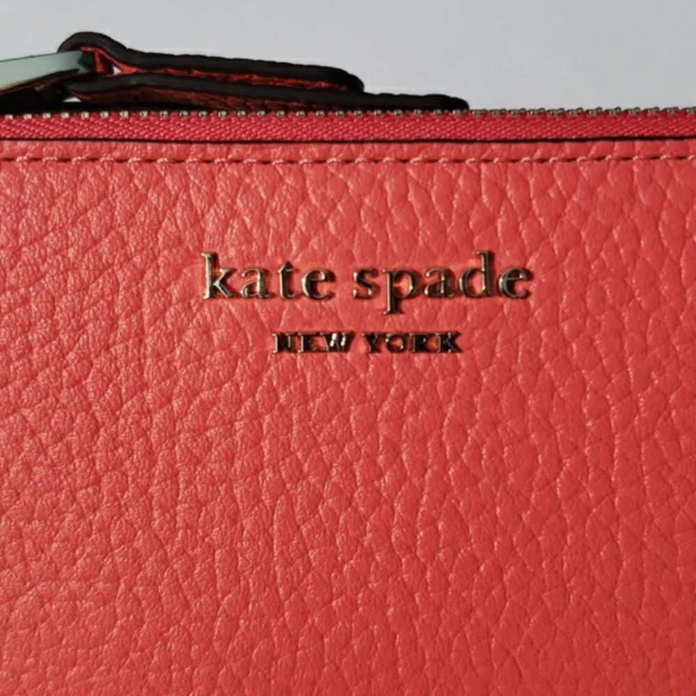Kate Spade Leather Roulette Small Slim Bifold Wallet. Color: Peachmelba.